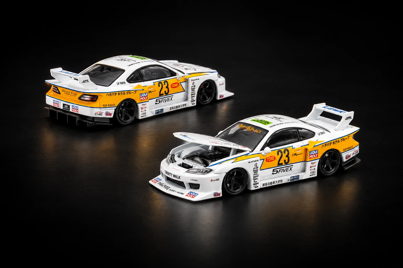 Two white and yellow Pop Race Liberty Walk S15 Silvia scale models on a dark studio floor